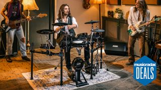 Man jams with a guitar player and bass player on an electronic drum kit