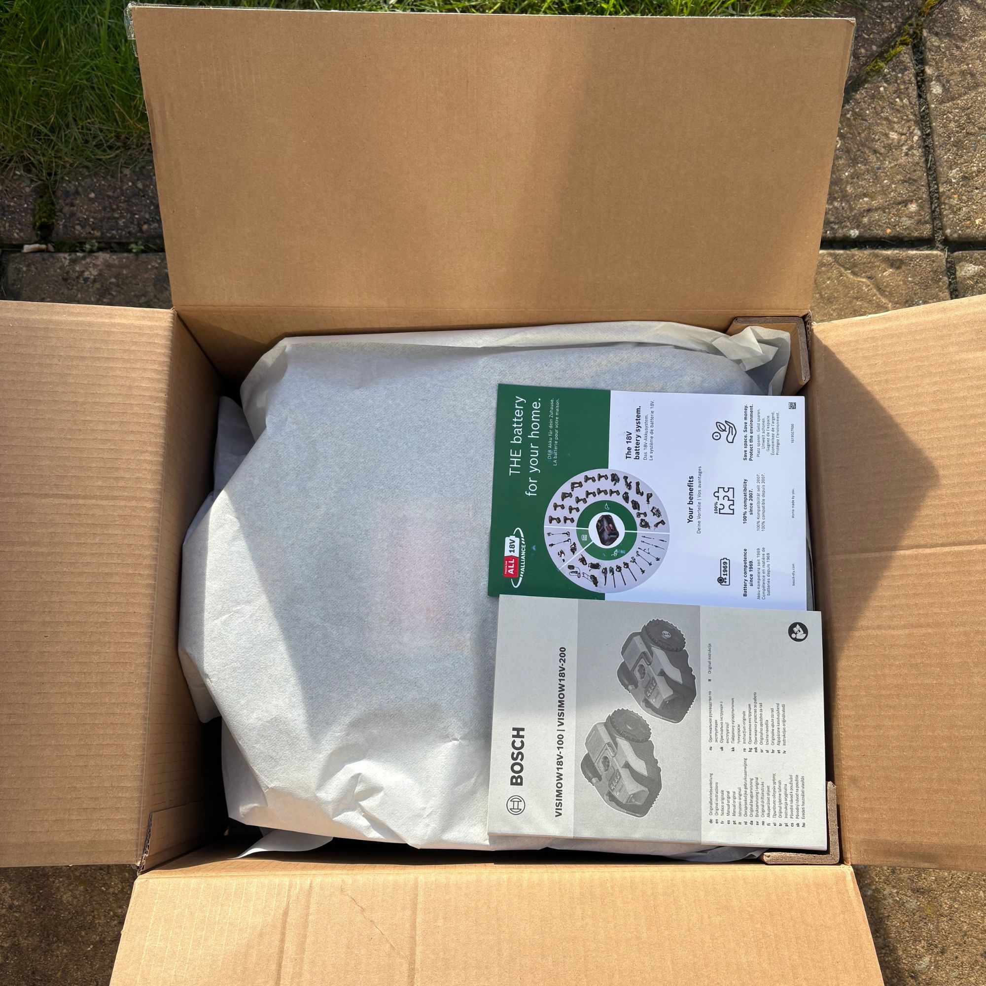 Bosch VISIMOW18V-100 Robot Lawn Mower in cardboard box packaging