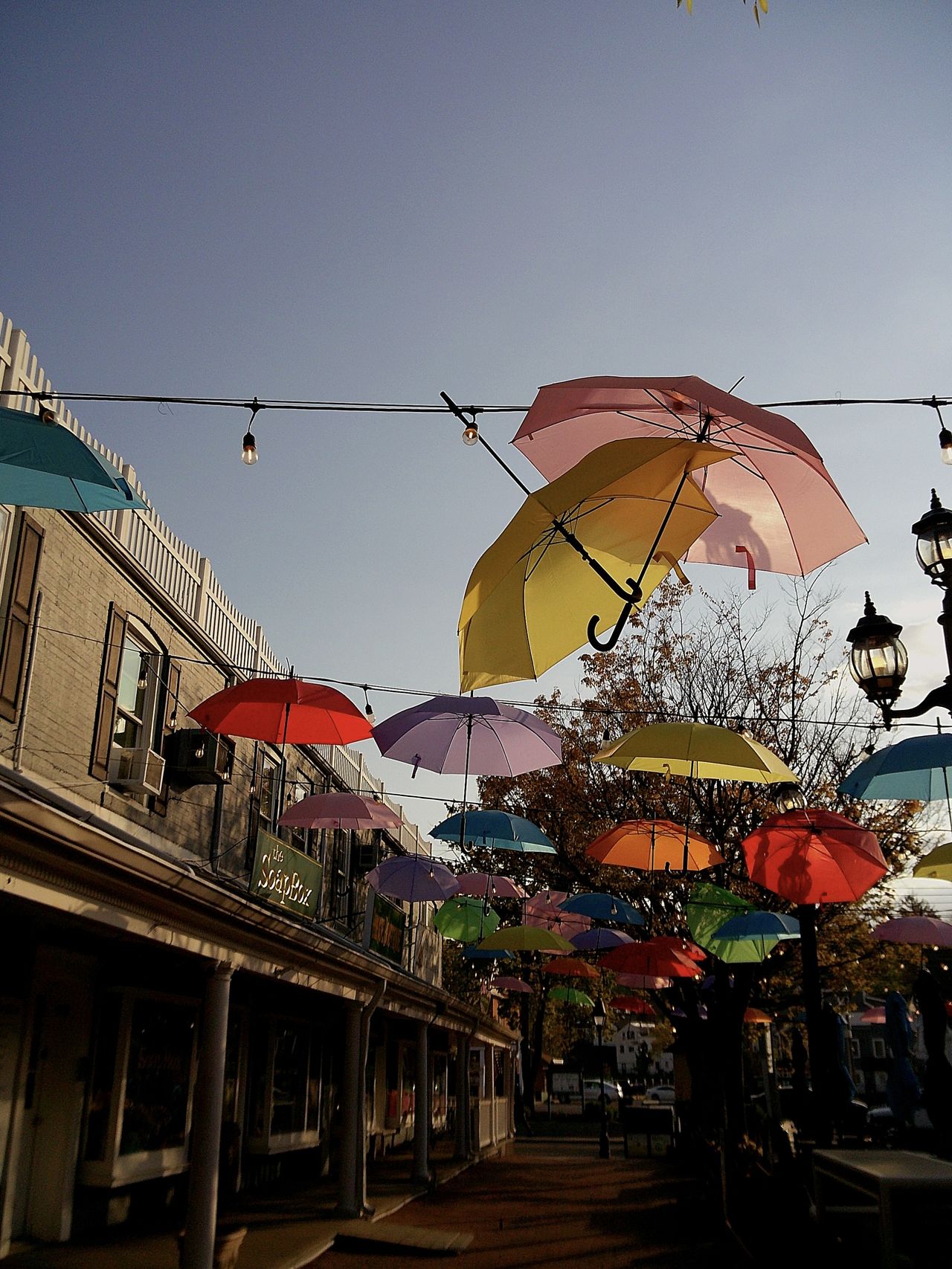 Sample image taken with Camp Snap 2 digital camera showing colored umbrellas strung across a street