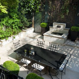 garden area with black table and plants