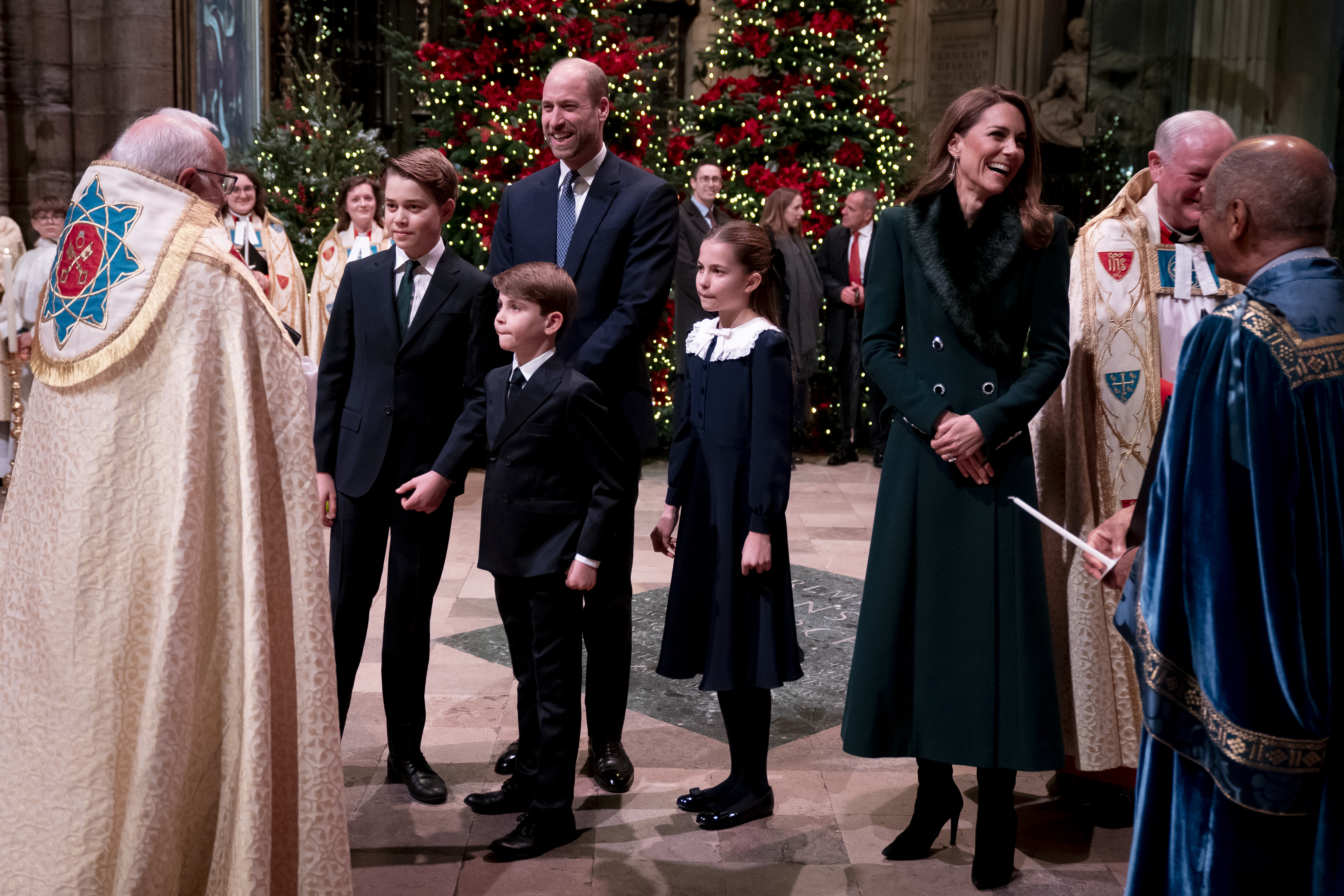 Prince George, Princess Charlotte and Prince Louis at Westminster Abbey talking to a clergyman