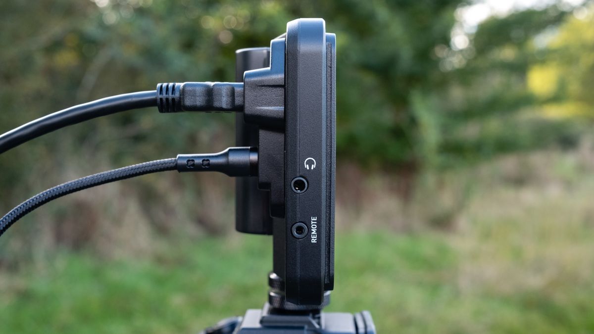 View of. the ports on the side of an Atomos Shinobi II camera monitor outside in a field