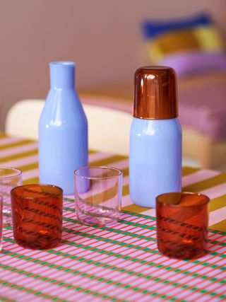 Ikea and Raw Color Tesammans blue carafes and red and clear glassware