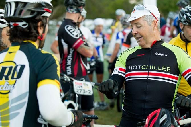 Stephen Roche shares a joke with other riders at the start of stage 5