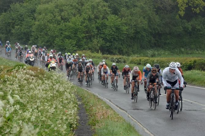The women's peloton in the rain