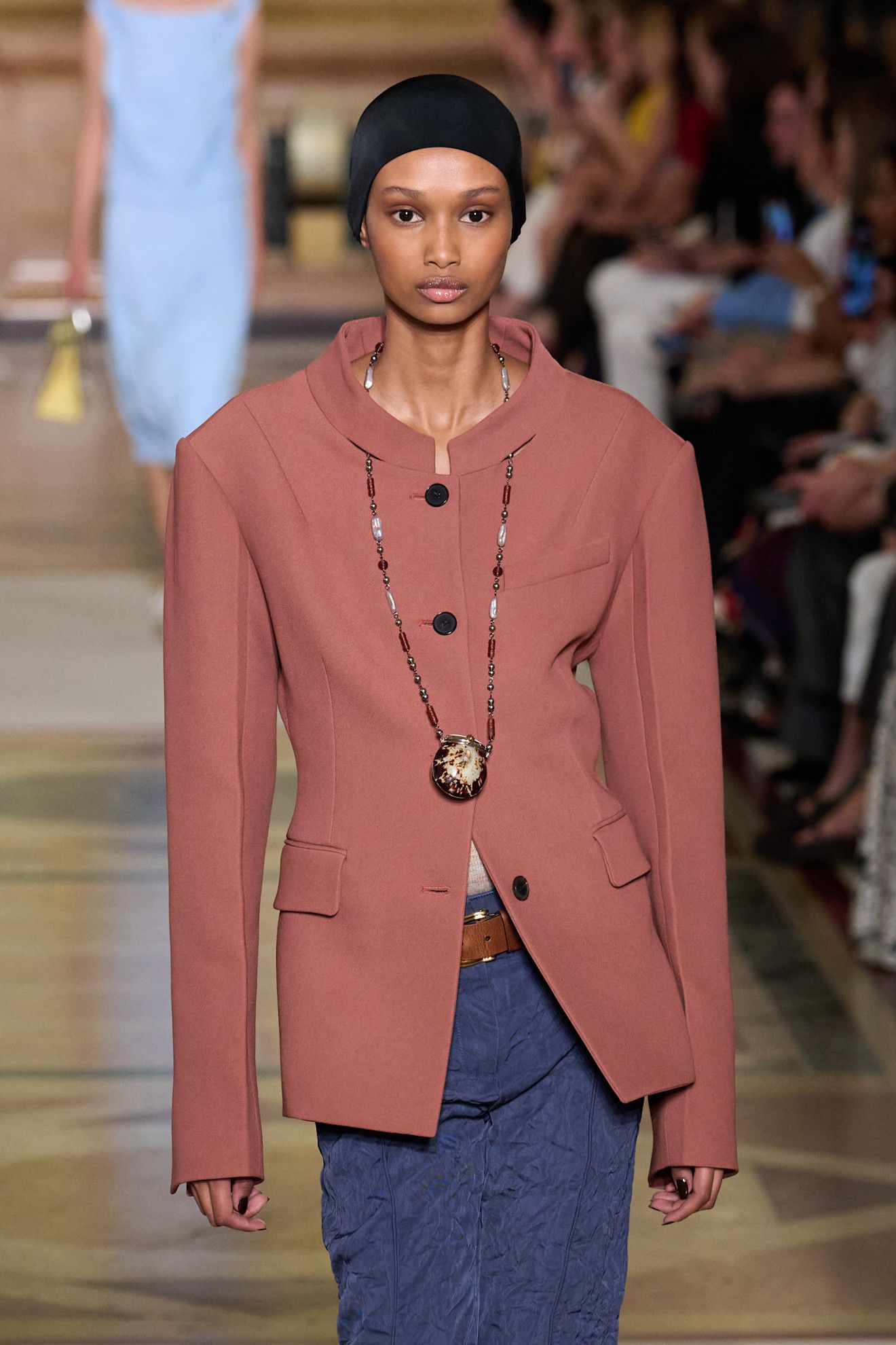 A model wearing a pendant necklace