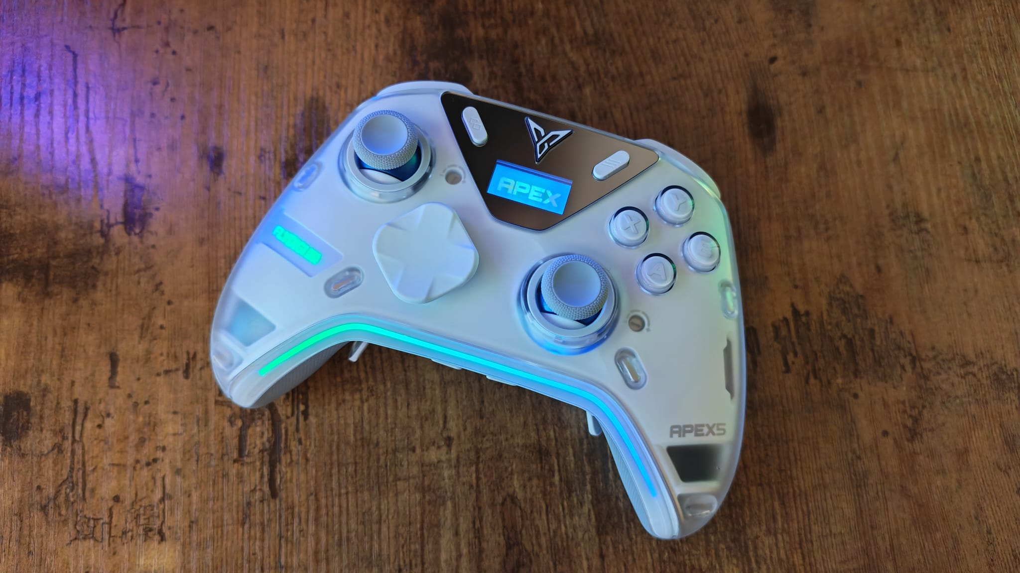 The Flydigi Apex 5 with its screen and lighting on