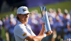Kristoffer Reitan holds the Truist Championship trophy