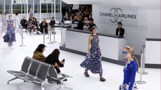 A model presents a creation for Chanelduring the 2016 Spring/Summer ready-to-wear collection fashion show, on October 6, 2015 at the Grand Palais in Paris. AFP PHOTO / PATRICK KOVARIK(Photo c