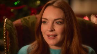 Lindsay Lohan smiling among very festive decorations in Falling for Christmas.