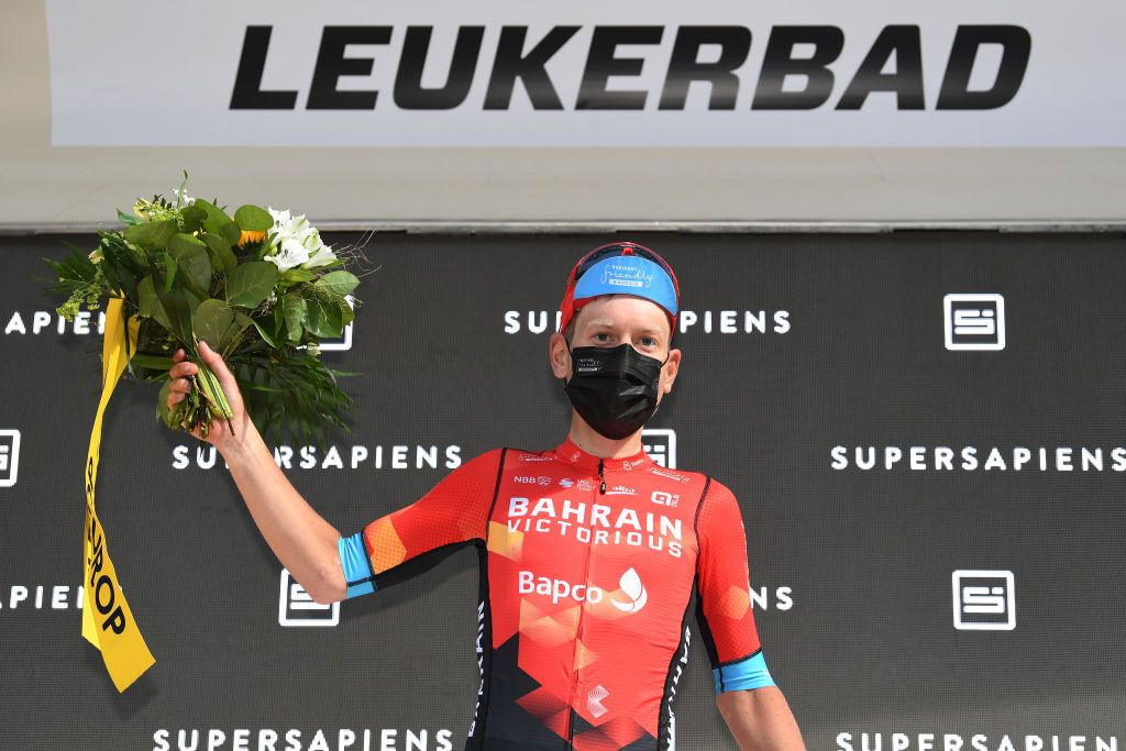 LEUKERBAD SWITZERLAND JUNE 10 Hermann Pernsteiner of Austria and Team Bahrain Victorious Most Combative Rider celebrates at podium during the 84th Tour de Suisse 2021 Stage 5 a 1752km stage from Gstaad to Leukerbad 1385m UCIworldtour tds tourdesuisse on June 10 2021 in Leukerbad Switzerland Photo by Tim de WaeleGetty Images