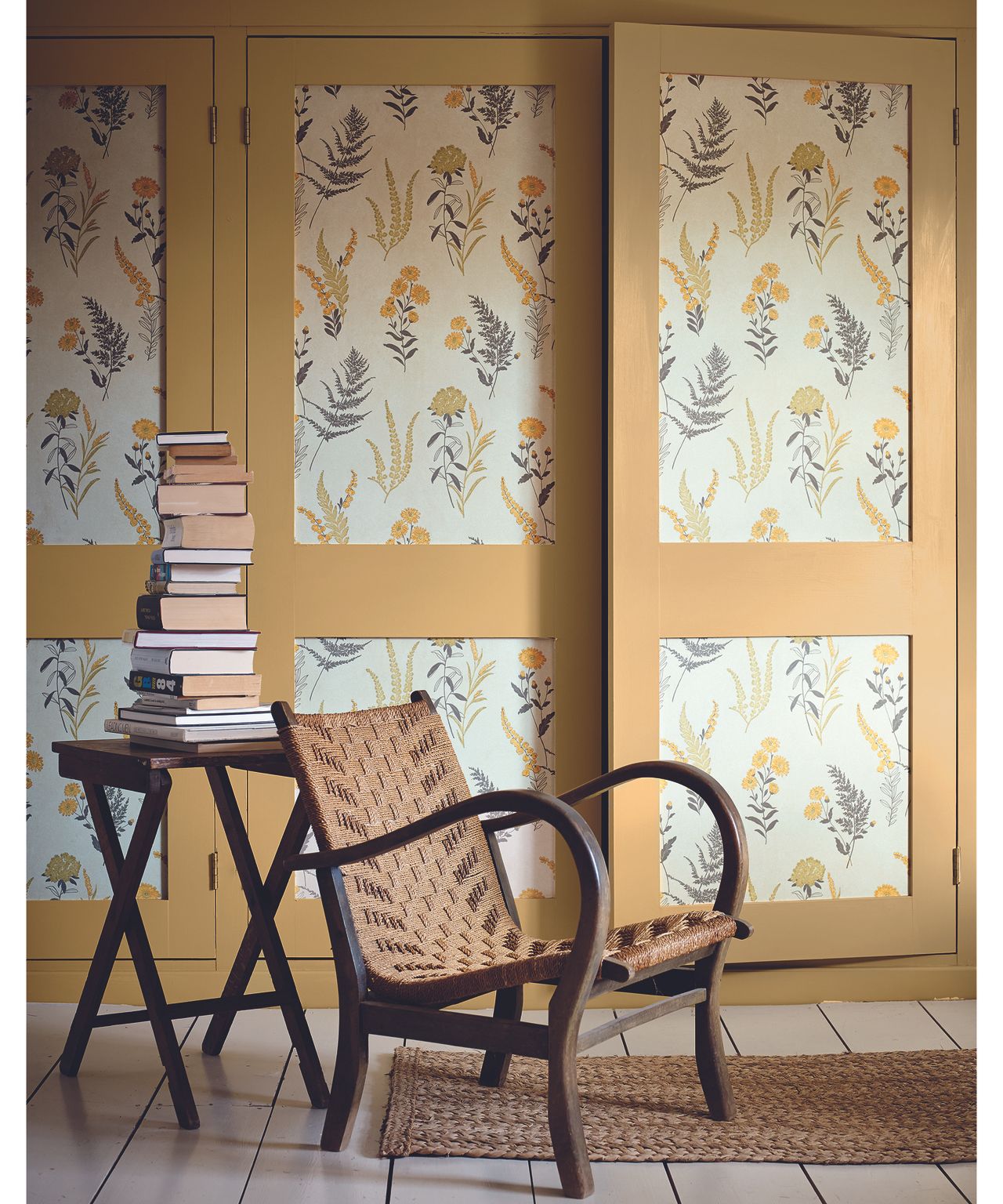 Yellow built-in wardrobe idea with printed wallpaper inserts