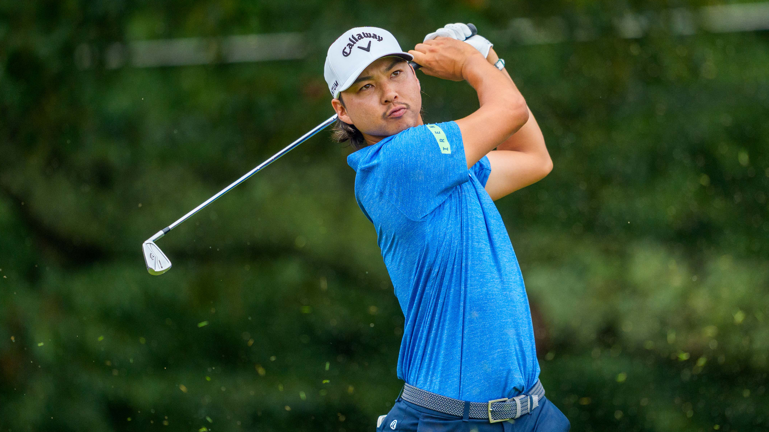Min Woo Lee holds his finish on an iron shot