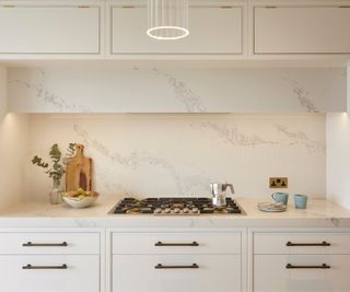 off which kitchen with white and grey marble worktops and splashback