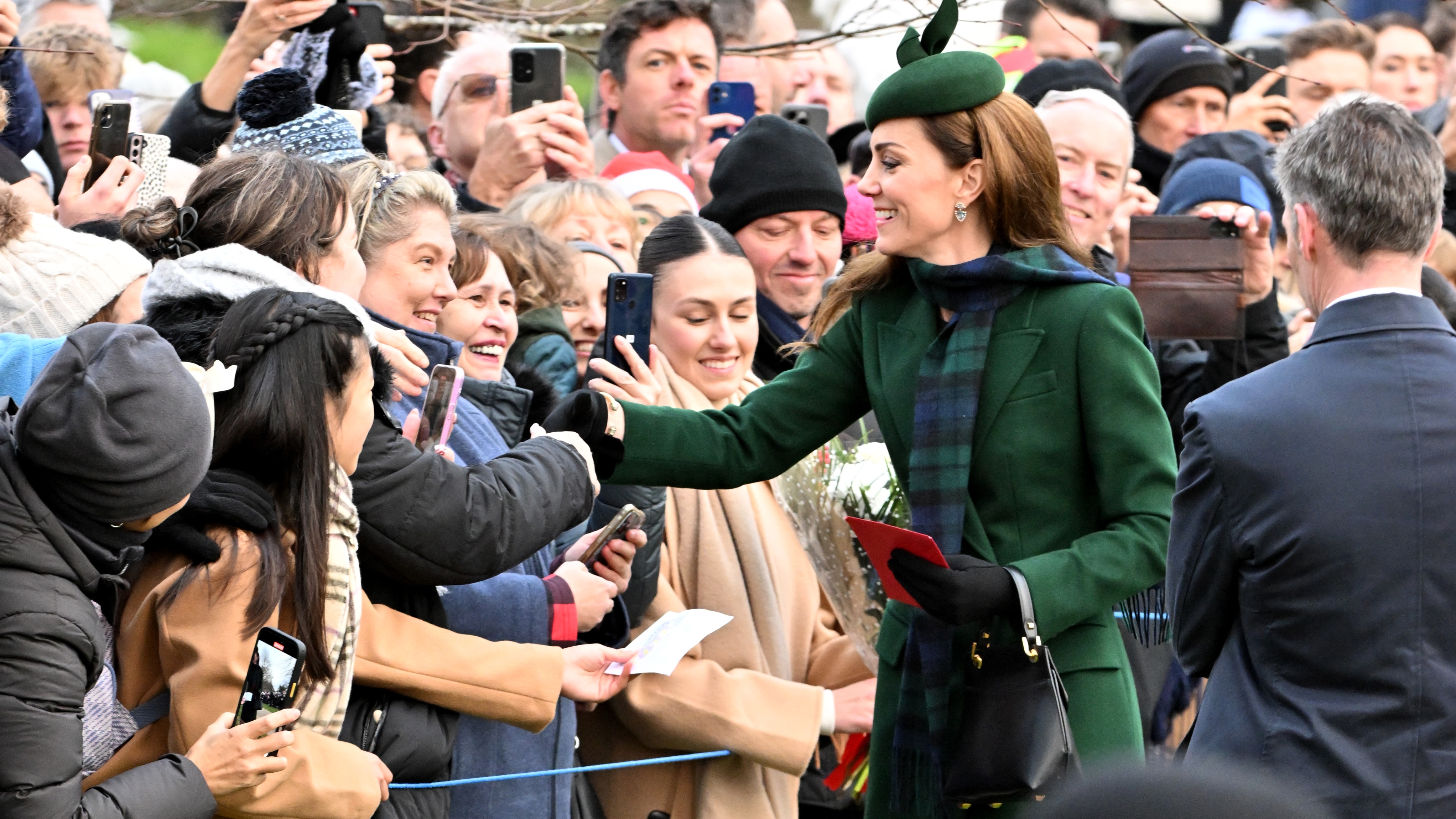 Catherine, Princess of Wales chats with fans as she attends the 2024 Christmas Morning Service at St Mary Magdalene Church on December 25, 2024