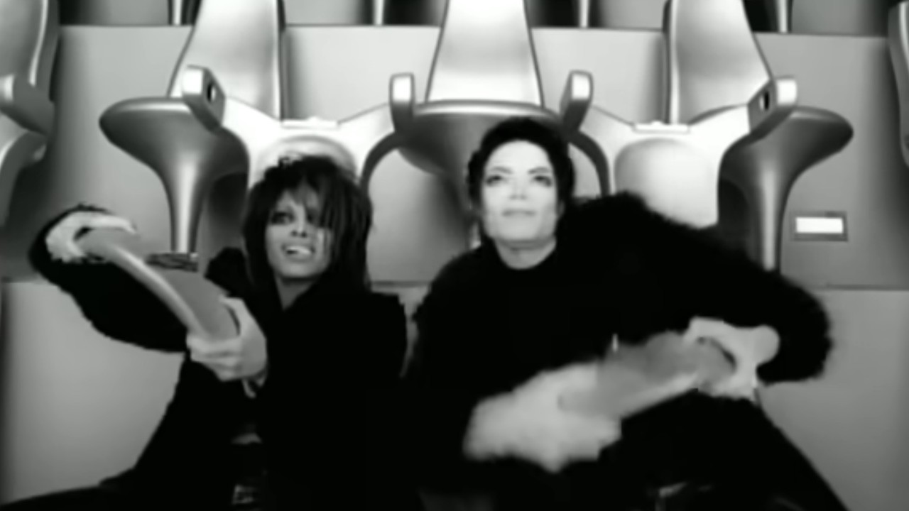 Janet and Michael Jackson playing a futuristic game in the music video for the song, "Scream"