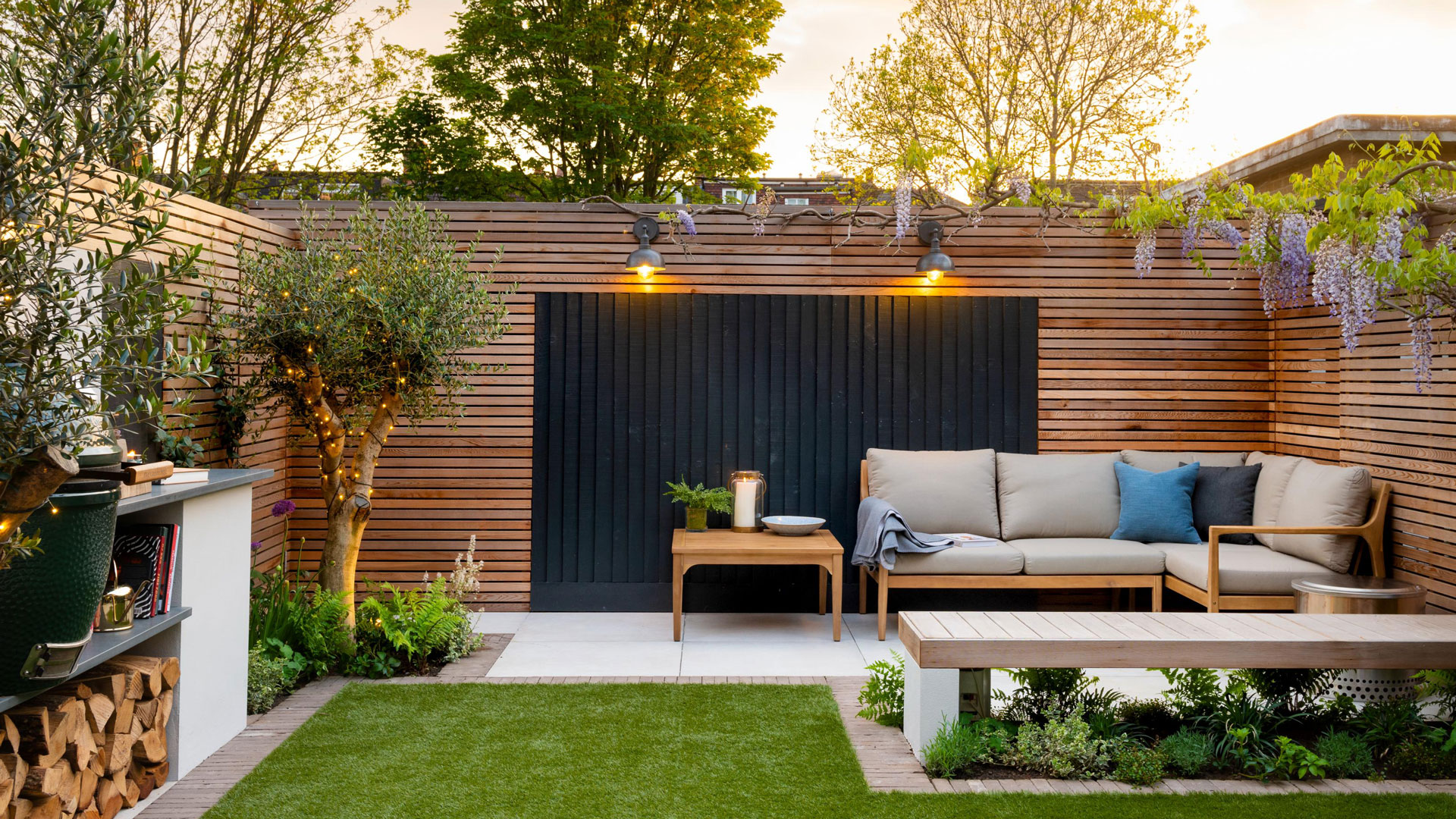 small modern patio with outdoor kitchen and modern fence