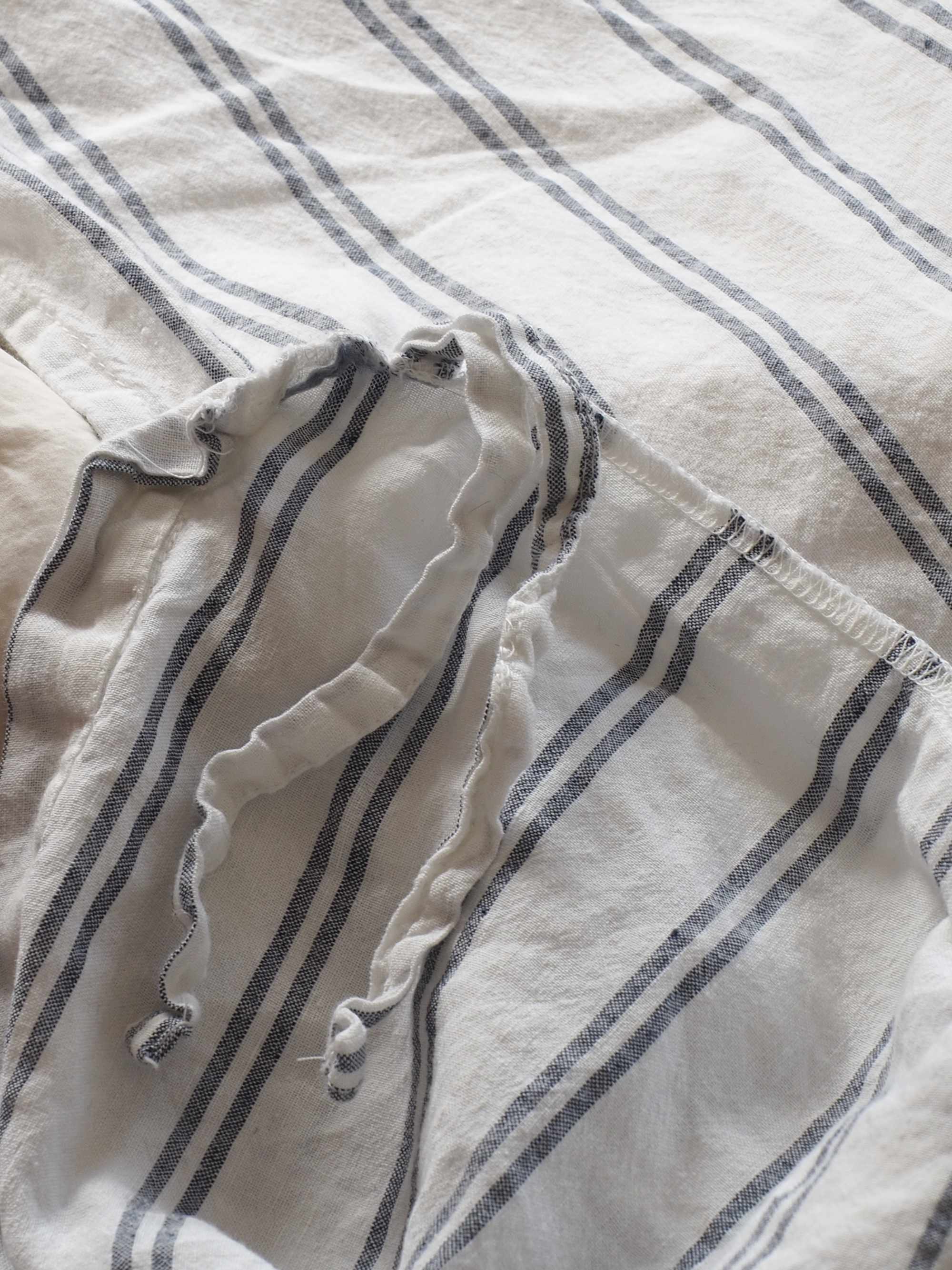 piglet in bed striped bedding close up