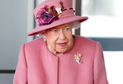 The Queen seen using a walking stick as she attends the opening ceremony of the sixth session of the Senedd at The Senedd on October 14, 2021