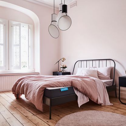 Simba Hybrid Mattress on a bed in a pink modern room