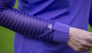 A close up of the Famara Sheer Sleeve Golf Shirt