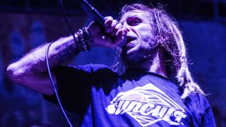 Randy Blythe performing onstage with Lamb Of God in 2017
