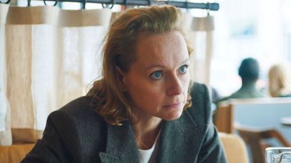 Samantha Morton looks across the table at someone