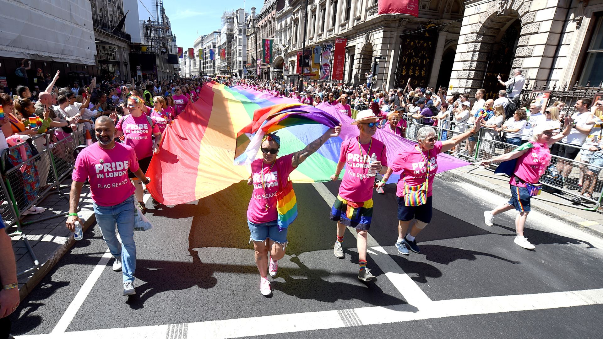 The rainbow flag is carried along Piccadilly by parade-goers during Pride In London 2024 on June 29, 2024 in London, England