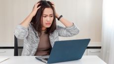 Angry person using a laptop