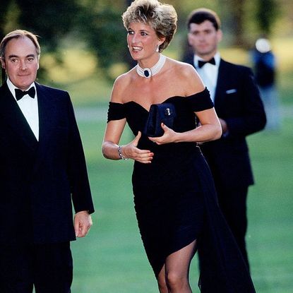 Lord Palumbo greets Princess Diana, wearing a short black cocktail dress designed by Christina Stambolian, as she atttends a Gala at the Serpentine Gallery in Hyde Park