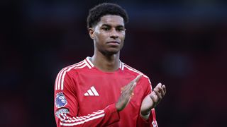 Marcus Rashford of Manchester United claps the fans ahead of the Arsenal vs Man Utd live stream in the midweek Premier League games December 2024