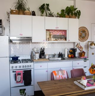 Small pink and white apartment kitchen