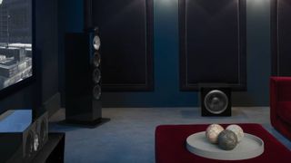 Bowers & Wilkins subwoofer and speakers in darkened home theater