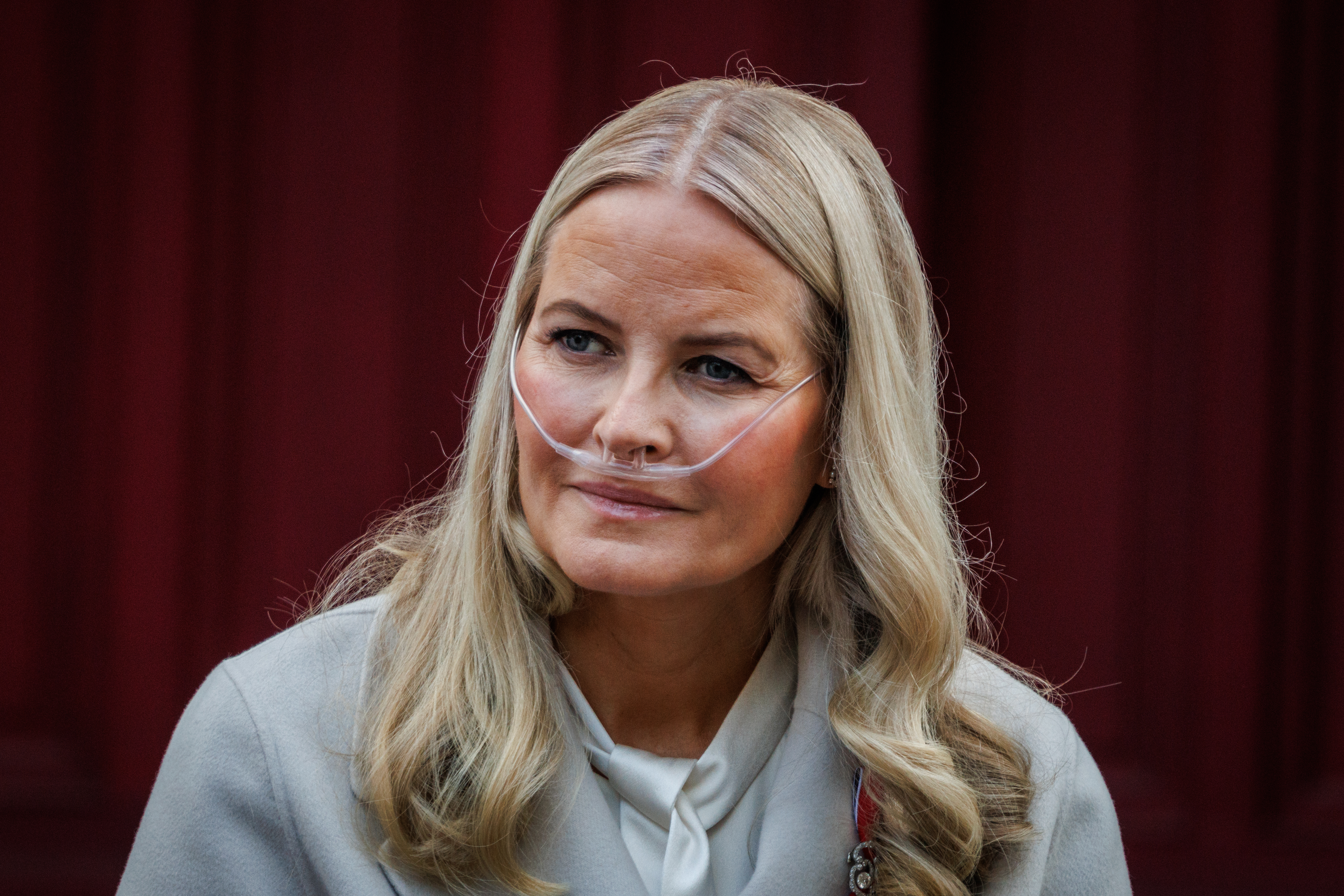 Queen Mette-Marit wearing an oxygen cannula