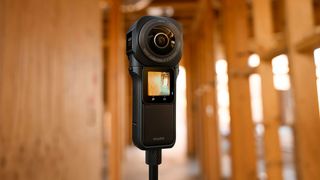 Insta360 ONE RS 1-inch 360 Edition action camera with old building in background