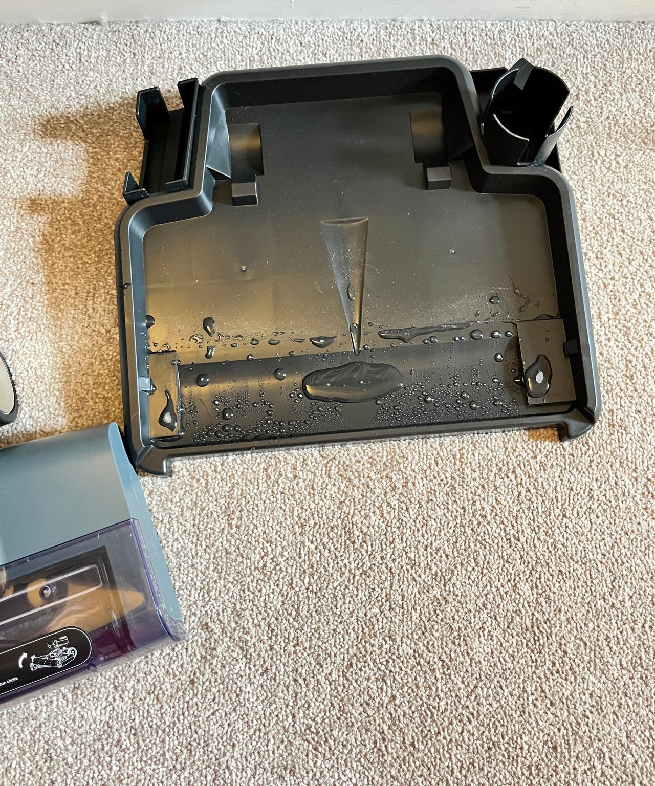 base tray of floor clear with small amount of water sitting on it