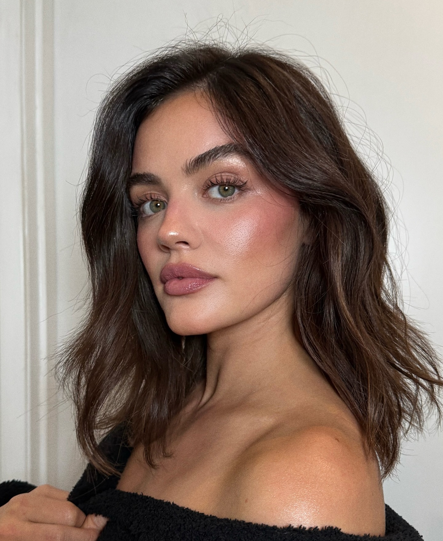 A selfie of Lucy Hale wearing pink blush and eye makeup
