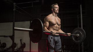 a photo of a man doing a barbell curl