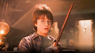 Daniel Radcliff as Harry Potter in a image from the first film of the Harry Potter movies in order