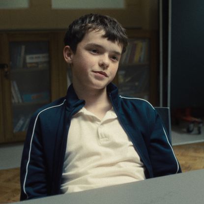 owen cooper in the interrogation room in a still from adolescence