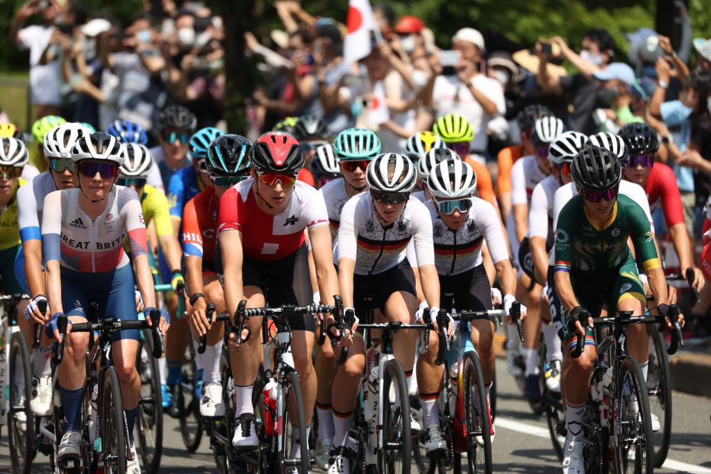 ride in the peloton during the womens cycling road race of the Tokyo 2020 Olympic Games after the race start Musashinonomori Park on the outskirts of Tokyo Japan on July 25 2021 Photo by MICHAEL STEELE POOL AFP Photo by MICHAEL STEELEPOOLAFP via Getty Images