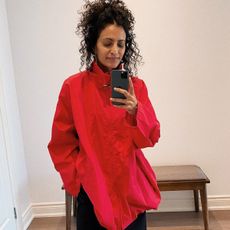 Neelam Ahooja wearing a red utility anorak from The Row.