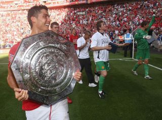 Cristiano Ronaldo celebrates with the Community Shield after Manchester United's win over Chelsea on penalties in August 2007.