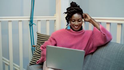 Woman working on her laptop at home