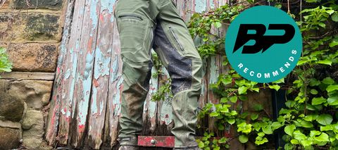 Leatt HydraDri 5.0 pants being worn near a distressed wooden door
