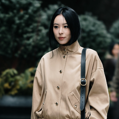 woman wearing a tan jacket in New York City