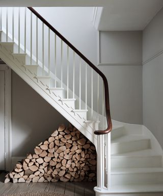 light gray entryway walls with white staircase