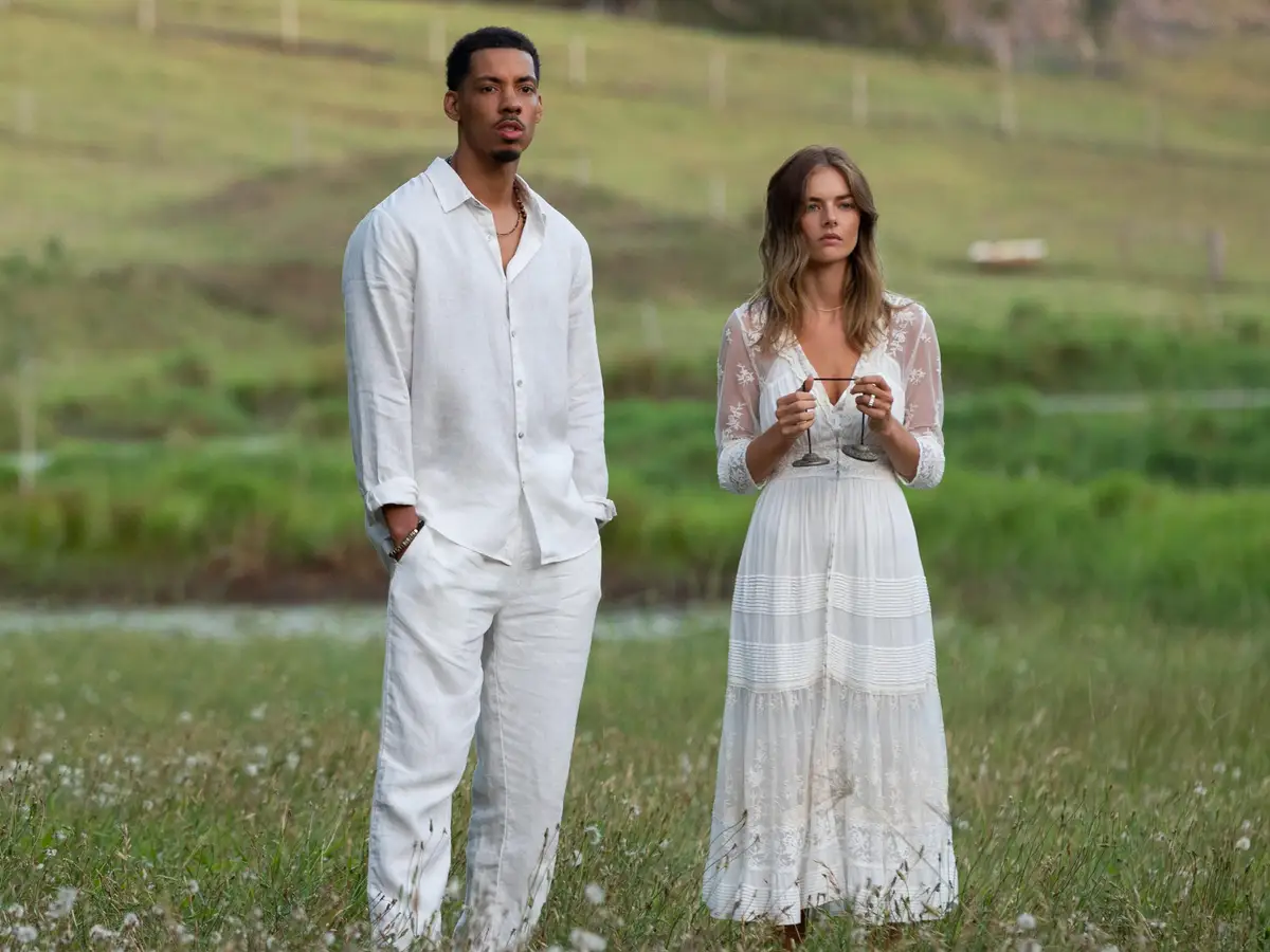 ben and jessica wearing white standing in a field in the nine perfect strangers season 1 finale