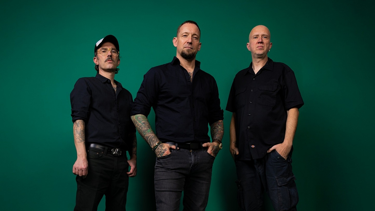 Volbeat stood against a green background
