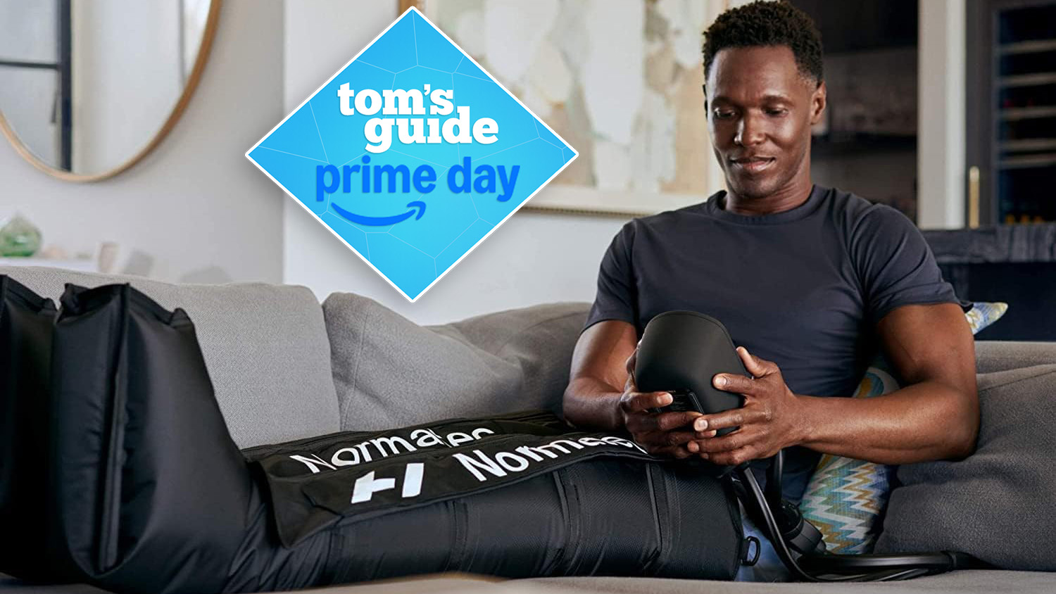 Hyperice Normatec 3 leg massager worn by male sitting on sofa in living room using device